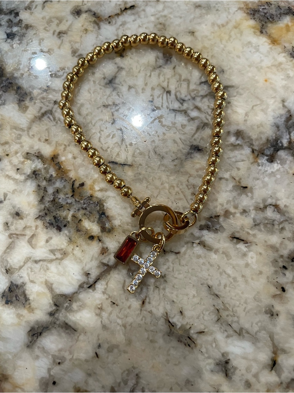 New in the box!Gold Beaded Bracelet with Red Crystal & Pave Cross Charm